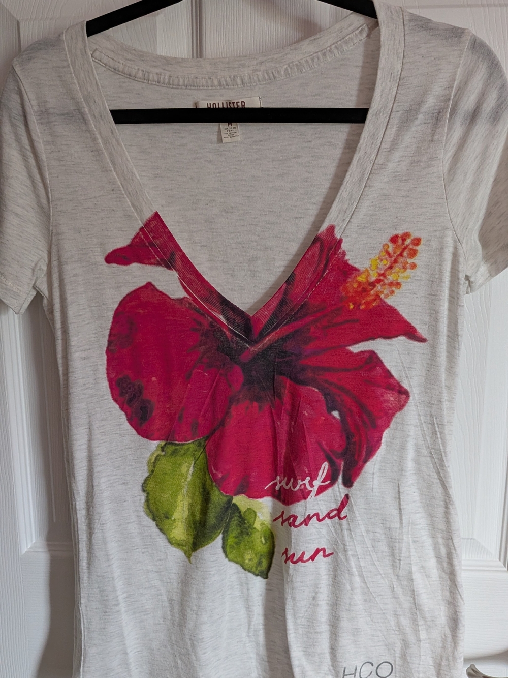 Hollister Women's White V-Neck Tee with Pink Hibiscus Graphic